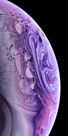 the back side of an iphone with purple and blue swirls on it's surface