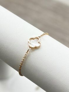 This minimalist, dainty adjustable slider bracelet is handmade with a beautiful CLOVER CHARM. The charm is made of 14k gold filled material. The adjustable chain and slider, is made of 18k gold filled chain and is hypoallergenic. It can fit up to an 8" wrist.  👉🏻This bracelet is lead and nickel free - perfect for anyone with sensitive skin!   Each bracelet is sold separately *  For direct link to purchase additional "layering" bracelets like in the photo sample, scroll to the bottom of this page for a direct link, or message seller.  NOTE:  Color may vary slightly than picture due to different display devices and settings.   👇🏻 👇🏻 👇🏻 📦📫FREE SHIPPING ON ALL DOMESTIC ORDERS OF $35 OR MORE! 📌CARE:  * Keep bracelet in a dry place and away from soaps, chemicals & lotions. 📌RETURNS: Adjustable Dainty 14k Gold Bracelet, Adjustable Yellow Gold Bracelets, Adjustable 14k Gold Bracelet With Simple Design, Adjustable Simple 14k Gold Bracelets, Dainty Adjustable White Gold Bracelet, Dainty Yellow Gold Bracelet With Adjustable Length, Dainty White Resizable Jewelry, Delicate Adjustable Bracelets As Gift, Delicate Adjustable Bracelets For Gifts