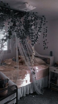 a bed with mosquito netting over it in a room filled with furniture and decor items