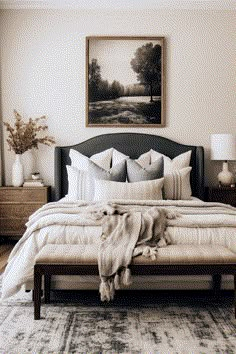 a bedroom with a large bed and two nightstands