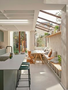 an open kitchen and living room with lots of natural light