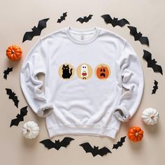 Get your little ones ready for the season with our adorable Kids Halloween Shirt, a must-have for every spooky wardrobe! Embrace the charm of a Vintage Halloween with this timeless design that's perfect for kids who love the magic of the season. The Pumpkin Shirt adds a festive flair, making it a favorite choice for both Halloween parties and everyday wear. Whether it's for school or a Halloween event, the Teacher Halloween shirt is a great way for educators to join in the spooky fun. Keep your Spooky Hooded Halloween Sweatshirt, Halloween Hooded Spooky Sweatshirt, Spooky Orange Crew Neck T-shirt, Halloween Crew Neck T-shirt With Character Print, Halloween Shirts Kids, Halloween Sugar Cookies, Teacher Halloween, Spooky Orange Cotton T-shirt, Teachers Halloween