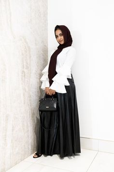 This fully lined maxi skirt sits at the slimmest part of the waist before falling to a floor-skimming hem. Pair it with a cute top to complete the look for your next special occasion or evening event. Made with vegan leather, this eco and animal friendly skirt features small pleats. Fully lined Hidden side pockets Concealed zipper at back Pleather (vegan leather) fabric Care Instructions: Hand wash cold / Do not bleach / Hang or line dry. Iron on medium inside out. Size Chart (in inches)Measurem Tiered Maxi Skirt For Fall Party, Chic Full Length Party Skirt, Full Length Maxi Skirt For Fall Party, Chic Ruffled Maxi Skirt, Fall Evening Wide Leg Maxi Skirt, Chic Ruffled Maxi Length Skirt, Date Night Long Skirt With Lining, Fall Evening Tiered Skirt, Chic Maxi Skirt For Night Out