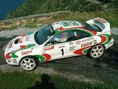 a white car with red, green and white paint on it