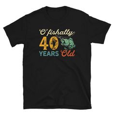 a black t - shirt with the number 60 years old printed in gold and green