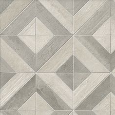 a white and grey tiled floor with different patterns on the tile, as well as an image