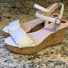 Kate Spade Ruffled Cork Wedge Shoes With White Genuine Leather Upper, Cork Sole, And Rubber Bottoms - New Without Tags - Rear Heel Height Is Roughly 3.8” #185-6o Kate Spade White Heels For Spring, Kate Spade Spring Platform Heels, Spring Platform Heels By Kate Spade, Chic White Kate Spade Heels, Kate Spade White Round Toe Heels, Kate Spade White Open Toe Heels, Kate Spade White Summer Heels, Chic Kate Spade Wedge Sandals With Round Toe, Kate Spade White Sandals With Round Toe