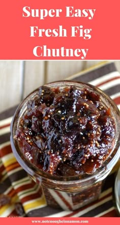 a jar filled with fresh fig chutney on top of a striped table cloth