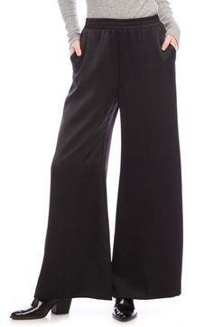 A versatile solid hue brings chic appeal to these flowy wide-leg pants crafted with a comfortable elastic waist. 29" inseam; 29" leg opening; 13" front rise; 16" back rise (size Medium) Pull-on style Front slant pockets 55% polyester, 45% recycled polyester Dry clean Made in the USA of imported fabric Versatile Wide Leg Pants For Spring Evening, Versatile Wide Leg Pants For Evening In Spring, Versatile Evening Wide Leg Pants For Spring, Casual Evening Pants, Casual Straight Pants For Evening, Stretch Rayon Wide Leg Bottoms, Chic Wide-leg Pants, Casual Wide Leg Pants For Spring Evenings, Fall Evening Wide Leg Pants With Pockets