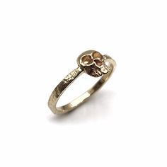 Absolutely gorgeous realistic memento mori skull gothic ring in all 14k solid gold. Extremely detailed design of the skull, hammered band for a rustic feel yet with tiny facets all over for a glossy silver shimmer. This minimalist cool and tough look ring is light and comfortable to wear and will be great for everyday use, as for a special occasion. Great choice as a gift to yourself or someone who can look this skull in the eyes. Features: * One solid 14k gold ring. * Skull is approximately: 10 White Gold Skull Ring As A Gift, White Gold Skull Rings As Gift, White Gold Skull Rings For Gifts, White Gold Skull Ring For Gift, Engraved Skull Ring For Anniversary, Engagement Ring Gothic, Memento Mori Skull, Memento Mori Ring, Surf Necklace