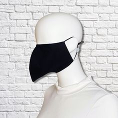 Bird beak face mask is made from two layers of 100% cotton fabric with elastic straps for behind the ears. Outer fabric is solid black. Elastic straps include silicone adjusters for perfecting your fit. Removable nose wire included. (Note: no filter pocket.) Inner fabric may vary. Mask is lightweight and washable. Tip of mask measures approximately 3 inches from face when worn. Inside is open with no filling to impede your breathing. Since the mask is completely open inside, inserting a tissue o Beak Mask, Cool Face Masks, Peacock Costume, Bird Beaks, Bird Masks, Mask Black, Last Minute Halloween Costumes, Face Mask Black, No Filter