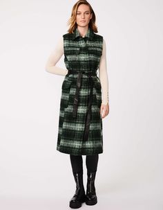 Wrap up the below-knee length of your long plaid wool vest with its matching tie-up belt. Streamline the silhouette or wear it as an open layer. The versatile styling options make it a fun, cool-weather look, and warm in a wool blend with oversized patch pockets. Chic Wool Vest For Fall, Chic Fall Wool Vest, Plaid Sleeveless Outerwear For Fall, Wool Flannel Dress, Plaid Wool Vest, Long Wool Plaid Skirt, Wrap Vest, Retro Wool Plaid Outerwear, Vintage Plaid Outerwear With Button Closure