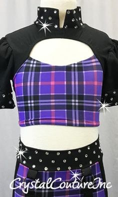 A Black and Purple Plaid lycra two-piece with a half-sleeved crop top and trunks. The cropped top has cut outs near the upper chest and mid-back, and rhinestoned collar and sleeves with a zipper down the back. The trunks are mostly Purple plaid with Black sides and a rhinestoned waist band, and are detailed with hanging suspender-like straps off of silver hoops on each hip. Over 1 gross of stunning Swarovski XIRIUS Crystal 30ss rhinestones!!! Purple Stretch Crop Top With Short Sleeves, Fitted Purple Sets With Short Sleeves, Baggy Clothing, Costumes For Sale, Purple Plaid, Black And Purple, Cropped Top, Silver Hoops, Waist Band