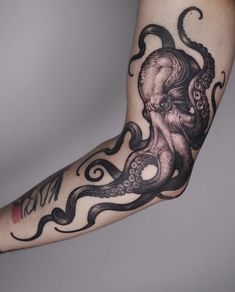 an octopus tattoo is shown on the arm