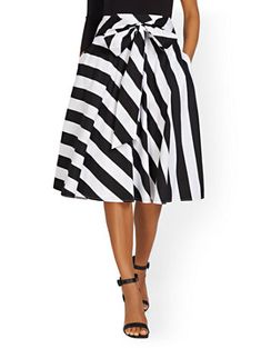 Shop Tie-Waist Stripe Midi Skirt. Find your perfect size online at the best price at New York & Company. Chic Midi Skirt With Belt, Chic Full Skirt For Day Out, Belted Midi Skirt For Day Out, Chic Belted Midi Skirt, Casual Belted Midi Bottoms, Chic Skirt With Banded Waist, Belted Skirt For Spring Day Out, Spring Belted Skirt For Day Out, Chic Belted Skirt For Day Out