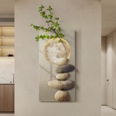 a painting on the wall with rocks and a plant growing out of it's center