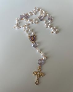 Our Purple Crystal Heart + Pearl Handmade Rosary is made with love and care. It is a 5 decade rosary made with recycled glass and metal materials.  * Portion of profits are given to our local parish.  * Each rosary is made to order. Please allow 1-2 days for processing and creation time.  * Each rosary comes with a rosary prayer guide, which guides you on how to use the rosary for prayer. Rosary Aesthetic, Rosary Prayer Guide, Rosary Guide, Rosary Design, Catholic Aesthetic, Prayer Guide, Handmade Rosary, Custom Rosary, Decade Rosary