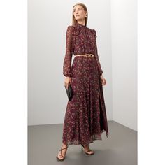 Red floral cotton (100% Silk). Lining (100% Polyester). A-line. Long sleeves. Mock neck. Back zipper closure. 55" from shoulder to hemline. Imported. Floral Print Maxi Dress For Fall Daywear, Fall Floral Print Maxi Dress For Daywear, Feminine A-line Maxi Dress For Fall, Red Maxi Dress For Workwear In Fall, Chic Burgundy Maxi Dress For Fall, Feminine Red Midi Dress For Fall, Elegant A-line Floral Dress For Fall, Feminine Fall Maxi Dress For Workwear, Feminine Fall Workwear Maxi Dress