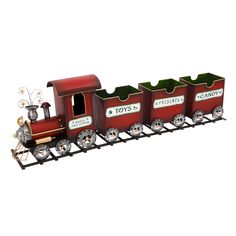 a toy train with three cars on the front and one car attached to the back