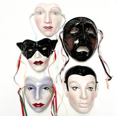 four masks with different facial shapes and colors are shown in front of a white background