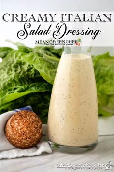 creamy italian salad dressing in a glass bottle next to lettuce and a cookie