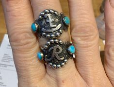 Want 20% off this item? Go here to claim your coupon code! https://pintody.com/pages/discounts This Turquoise initial ring features 2 Kingman turquoise and a letter or brand of your choice. The ring is made from solid sterling silver and textured with a tooled leather pattern for a unique ring that makes a statement. A perfect gift for the turquoise lover in your life. We will make the ring to your size. This ring fits true to size so order your usual ring size. Want your brand on it? See last p Handmade Western Turquoise Ring In Sterling Silver, Western Style Turquoise Sterling Silver Ring, Adjustable Blue Turquoise Western Ring, Silver Western Rings, Silver Southwestern Turquoise Ring Gift, Tooled Leather Pattern, Brand Rings, Western Ring, Western Wedding Rings