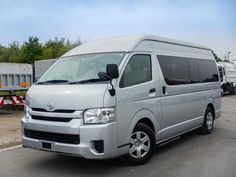 a silver van parked in a parking lot