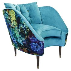 a blue chair with floral designs on it