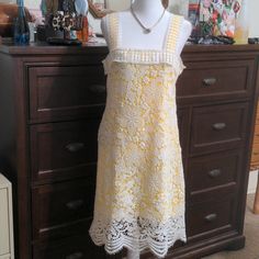 Romeo & Juliet Couture White Lace Dress With Yellow Lining. It Has A Side Zipper. Pit To Pit Measures 17" And The Length Is 37". Fits Size M And Is Brand New With Tags. Yellow Lace Dress For Spring, Elegant Yellow Mini Dress For Garden Party, Spring Yellow Lace Mini Dress, Yellow Lace Mini Dress For Summer, Yellow A-line Dress For Daywear, Yellow Fitted Dress With Lace Trim, Elegant Yellow Lace Dress For Spring, Yellow Lace Sleeveless Dress, Yellow Fitted Lace Midi Dress