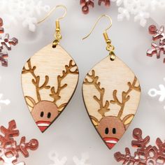 Rudolph the red-nosed reindeer is ready to light the night this holiday season! These adorable Christmas Earrings are laser cut, engraved, and hand painted on 3mm Birch wood. Hardware is gold plated sterling silver. Earrings are approximately 2 inches long and 1 inch wide. Earrings are very light, you will forget that you have them on.Thank you for visiting Sprouting Expressions, please see my other listings and like my shop for updates on new products and sales! I hope you love my handmade item Wood Christmas Earrings, Christmas Earrings Diy, Diy Christmas Earrings, Laser Christmas, Xmas Earrings, Wood Hardware, Fall Scarecrows, Jewelry Holiday, Christmas Painting