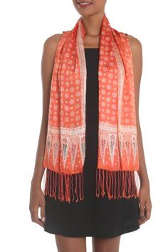 Associated with Javanese royalty traditional truntum motifs are realized in colors of tangerine and ivory to decorate the smooth silken body of this Majestic wrap scarf from Bali. Yuni Kristina employs the batik method drawing the starry motifs with a wax resist before applying colorful dyes. Long delicate fringes finish the scarf. Traditional Printed Spring Dupatta, Spring Traditional Printed Dupatta, Traditional Printed Dupatta For Spring, Bohemian Orange Silk Dupatta, Traditional Patterned Dupatta For Summer, Traditional Dupatta With Summer Patterns, Traditional Summer Dupatta With Traditional Patterns, Traditional Orange Spring Dupatta, Traditional Orange Dupatta For Spring