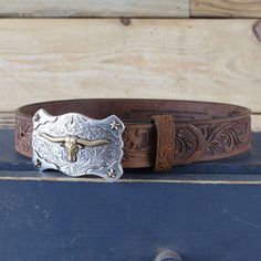 Western Style Brown Belt With Engraving, Western Brown Engraved Belt, Western Style Engraved Adjustable Belts, Western Style Adjustable Engraved Belts, Western Style Engraved Belt For Ranch, Western Engraved Adjustable Belt, Western Adjustable Engraved Belts, Engraved Western Belt For Ranch, Engraved Brown Belt Buckles For Western-themed Events