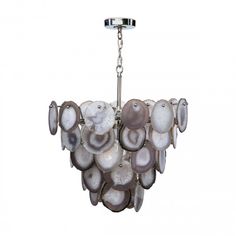 a chandelier made out of shells on a white background