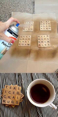 a cup of coffee sitting on top of a table next to some scrabbles