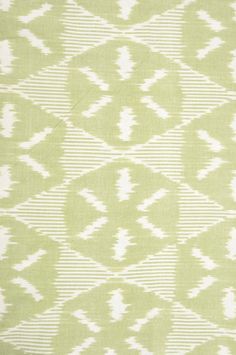 a green and white pattern on fabric