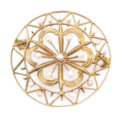 "This antique brooch, a Victorian piece from the late 1800s/early 1900s, is hand made of 10K yellow gold wire wrought in a perfect circle with radiate triangles inside -- an unmistakable image of the sun. Inside of the sun is a delicate rosette, beautifully accented with seed pearls. The pin mechanism would allow for the piece to be worn either as a brooch or, when suspended from a chain, as a pendant. DETAILS METAL: 10K Yellow Gold PEARLS: 20x natural pearls WEIGHT: 4.0g DIAMETER: 1.27\"	in sto Antique Yellow Gold Brooches With Intricate Design, Antique Yellow Gold Filigree Brooches, Vintage Yellow Gold Baroque Brooch, Ornate Yellow Gold Brooch For Ceremonial Use, Ornate Yellow Gold Brooches For Ceremonial Use, Ornate Yellow Gold Brooches For Ceremonial Occasions, Victorian Filigree Brooches For Vintage Events, Heirloom Gold Brooch With Intricate Design, Heirloom Gold Brooches With Intricate Design