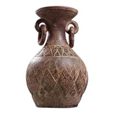 a brown vase with an intricate design on the front and sides, isolated against a white background