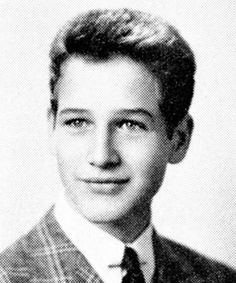 an old black and white photo of a young man