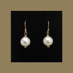 These elegant drop earrings are quality crafted using: > Natural Freshwater Pearls > German Style 24k Gold Plated Wire > 24k Gold Plated Jump Ring Connectors > 14k Gold Plated Solid 925 Sterling Silver (stamped) Ear Wires  They are the perfect accessory for adding a little color to your day or any outfit!  A great addition to any earring collection!  Classy - Elegant  Hypoallergenic & Nickel Free Ear Wires Pearl:  Size:  9-10mm  (3/8 inch) Drop Length:  25mm (1 inch) ❤️ Earrings are shipped with Nickel Free Classic Dangle Pearl Earrings, Classic Nickel-free Dangle Pearl Earrings, Classic Teardrop Nickel-free Pearl Earrings, Classic Round Pearl Drop Jewelry, Formal Round Jewelry With Ear Wire, Classic Hypoallergenic Dangle Pearl Earrings, Classic Jewelry With Ear Wire For Gift, Classic Gold Jewelry With Pearl Drop, Gift 14k Gold Pearl Earrings With Ear Wire