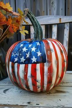 a painted pumpkin with an american flag design