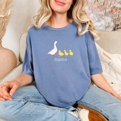 Welcome to my shop where you can find your Motherhood apparel needs! Personalize this adorable goose tshirt with the number of kids you have! PRODUCT INFO Comfort Colors 1717 is made 100% with US ring-spun cotton for long-lasting comfort. The soft-washed, garment-dyed fabric brings extra coziness to your wardrobe while the relaxed fit makes it an excellent daily choice, for both the casual and semi-formal settings. The fabric is pre-shrunk to ensure a great fit. ETHICALLY GROWN Made using 100% U Welcome Shirts For Baby, Triplet Pregnancy Announcement, Triplet Pregnancy, Triplets Pregnancy, Goose Birthday, Mom And Kids, Triplet Babies, Number Shirt, Kids Tshirt