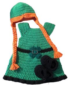 a crocheted green dress with an orange hat and black booties on it