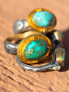 We've teamed up Our Egyptian style ring, from Jenson Studios. Gem quality turquoise, the most amazing cocktail ring, and a perfect accent to our bride rings. Beautifully accented with 22k gold and Jensen's signature distressed silver technique. Comfort fit rings with beautifully lined gold bands. Starting at $1598 prices vary on size of stone and quality ie: Bisby, Rare or larger stones will cost more. Please contact for availabilty Gold Turquoise Ring With Gemstone Accents, Turquoise Ring With Patina For Anniversary, Unique Gold Turquoise Ring With Gemstone, Anniversary Turquoise Ring With Patina, Gold Oval Turquoise Sterling Silver Ring, Gold Oval Turquoise Ring In Sterling Silver, Unique Gold Open Turquoise Ring, Oval Gold Turquoise Ring In Sterling Silver, Artisan Oval Ring With Patina