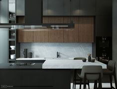 a modern kitchen with black cabinets and white counter tops