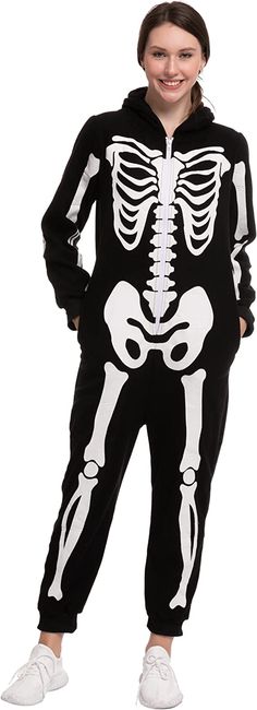 a girl in a skeleton costume posing for the camera with her hands on her hips