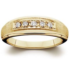 a yellow gold wedding ring with five diamonds on it's side, set in 18k yellow gold