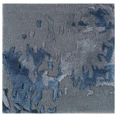 an area rug with blue and gray colors