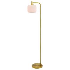 a brass floor lamp with a white glass shade