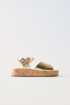 METALLIC SANDALS - Gold | ZARA United States Gold Flat Heel Sandals With Buckle Closure, Spring Gold Footbed Sandals With Buckle Closure, Summer Ankle Strap Sandals With Textured Sole, Gold Footbed Sandals With Buckle Closure For Summer, Gold T-strap Sandals With Buckle Closure, Gold Open Toe Footbed Sandals With Cork-bed Midsoles, Gold Open Toe Sandals With Cork-bed Midsoles, Casual Gold Sandals With Buckle Closure, Gold Sandals With Buckle Closure And Round Toe