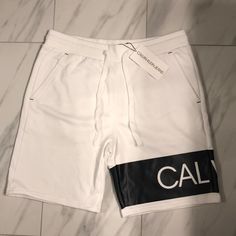 Men’s Calvin Klein Jeans Sweatshorts Price Is Firm At $45. Color: White/Black Condition: 10/10 New W Tags White Athletic Shorts For Spring, White Knee-length Athletic Shorts For Spring, Casual White Athletic Shorts, White Athletic Shorts For Streetwear In Spring, White Bermuda Bottoms For Loungewear, White Casual Shorts For Streetwear, Casual White Knee-length Shorts, Calvin Klein Sporty Shorts For Summer, Sporty White Bermuda Bottoms